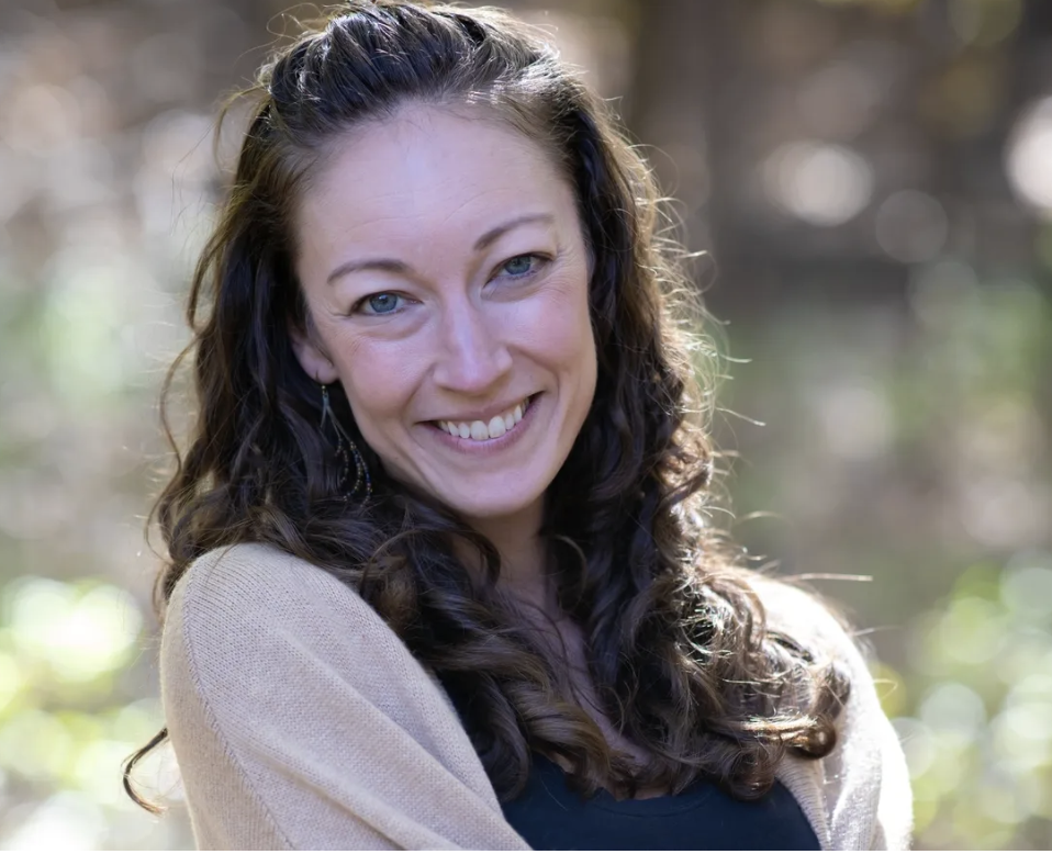 Melissa Dupuis smiling outdoors in soft natural light